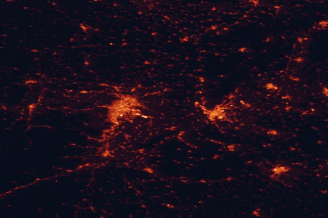 Satellite night-light map of the 100 km around Danube-Auen National Park, with Vienna, Bratislava and Petržalka marked