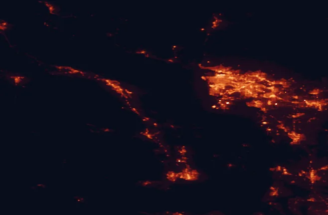 Satellite night-light map of the 100 km around Dionisio Point Provincial Park, with Vancouver, Surrey and Richmond marked