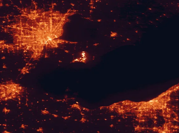 Satellite night-light map of the 100 km around Point Pelee National Park, with Detroit, Cleveland and Windsor marked
