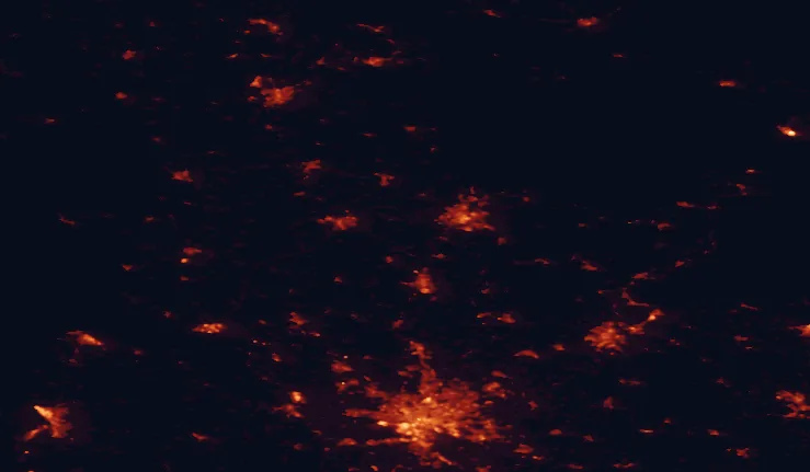 Satellite night-light map of the 100 km around Westensee Nature Park, with Hamburg, Kiel and Lübeck marked