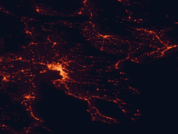 Satellite night-light map of the 100 km around Lakes Koronia-Volvi National Park, with Thessaloníki, Kalamariá and Évosmos marked