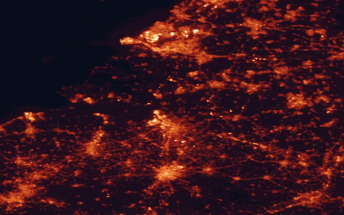 Satellite night-light map of the 100 km around De Zoom-Kalmthoutse Heide National Park, with Antwerp, Brussels and Rotterdam marked