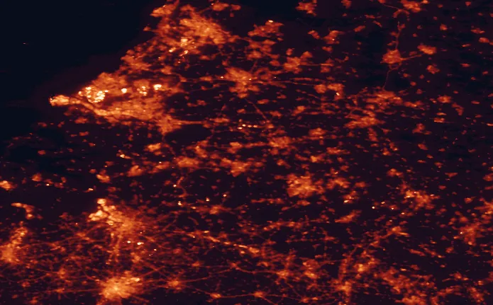Satellite night-light map of the 100 km around Van Gogh National Park, with Rotterdam, Brussels and Tilburg marked