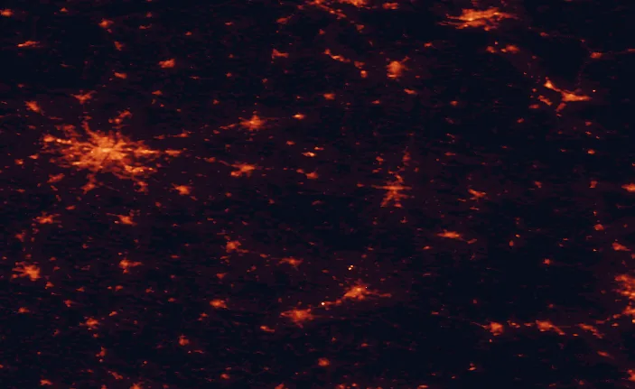 Satellite night-light map of the 100 km around Warta Landscape Park, with Poznań, Konin and Toruń marked
