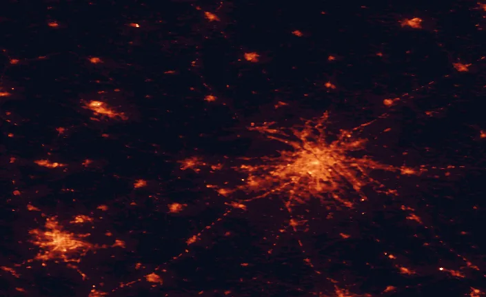 Satellite night-light map of the 100 km around Kampinos National Park, with Warsaw, Łódź and Mokotów marked