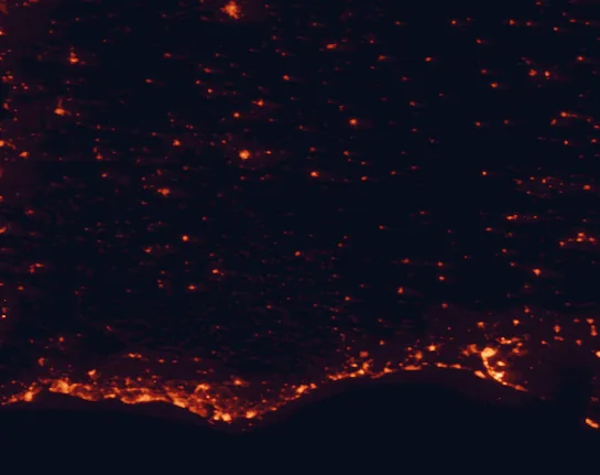 Satellite night-light map of the 100 km around Guadiana Valley Natural Park, with Huelva, Faro and Beja marked