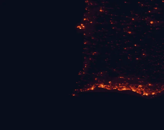 Satellite night-light map of the 100 km around Southwest Alentejo and Vicentine Coast Natural Park, with Portimão, Faro and Lagos marked