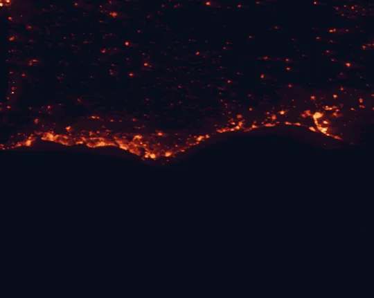 Satellite night-light map of the 100 km around Ria Formosa Nature Park, with Faro, Huelva and Olhão marked
