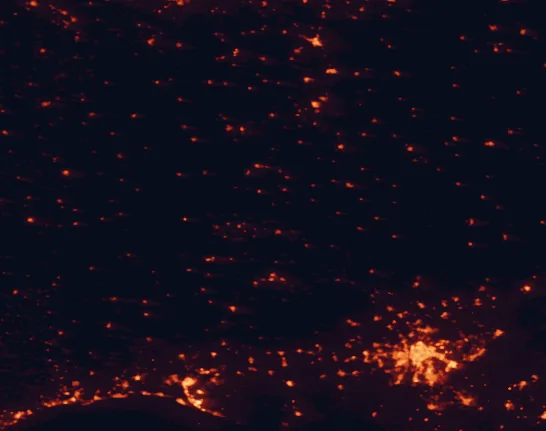 Satellite night-light map of the 100 km around Sierra de Aracena and Picos de Aroche Natural Park, with Sevilla, Huelva and Dos Hermanas marked