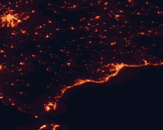 Satellite night-light map of the 100 km around Sierra de las Nieves National Park, with Málaga, Sevilla and Marbella marked