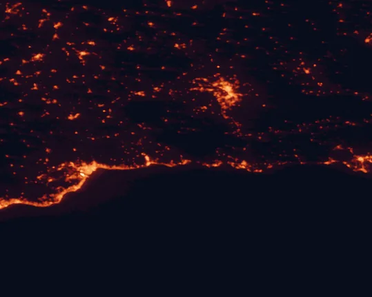 Satellite night-light map of the 100 km around Sierras de Tejeda, Almijara y Alhama Natural Park, with Málaga, Granada and Vélez-Málaga marked