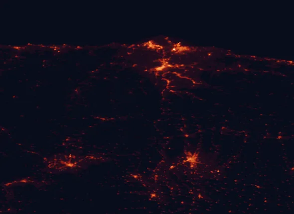 Satellite night-light map of the 100 km around Las Ubiñas-La Mesa Natural Park, with Oviedo, Gijón and León marked