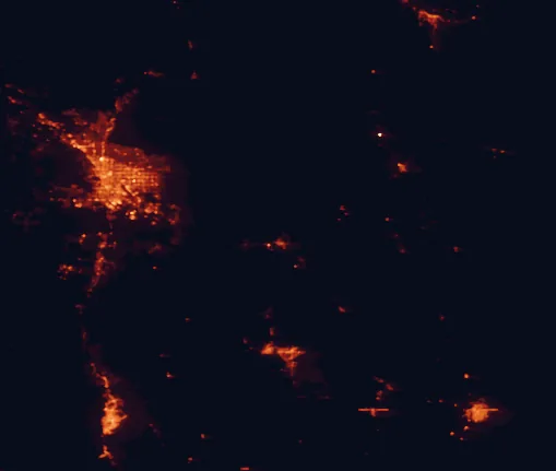 Satellite night-light map of the 100 km around Coronado National Forest, with Tucson, Nogales and Casas Adobes marked
