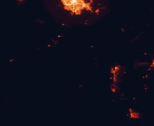Satellite night-light map of the 100 km around Castle Mountains National Monument, with Henderson, Enterprise and Bullhead City marked