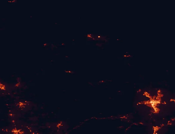 Satellite night-light map of the 100 km around Plumas National Forest, with Reno, Sparks and Carson City marked
