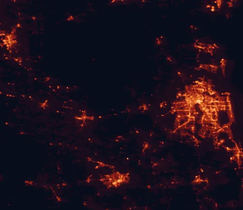Satellite night-light map of the 100 km around Osceola National Forest, with Jacksonville, Gainesville and Valdosta marked