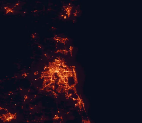 Satellite night-light map of the 100 km around Timucuan Ecological and Historic Preserve, with Jacksonville, Gainesville and Ponte Vedra Beach marked