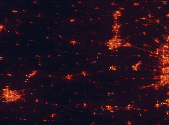 Satellite night-light map of the 100 km around White Pines Forest State Park, with Rockford, Davenport and Janesville marked