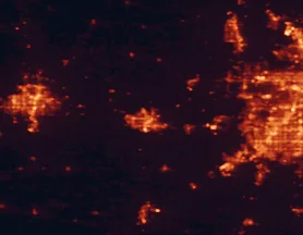 Satellite night-light map of the 50 km around Lawrence, with Olathe, Topeka and Shawnee marked