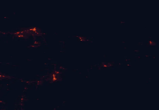Satellite night-light map of the 100 km around Hiawatha National Forest, with Marquette and Escanaba marked