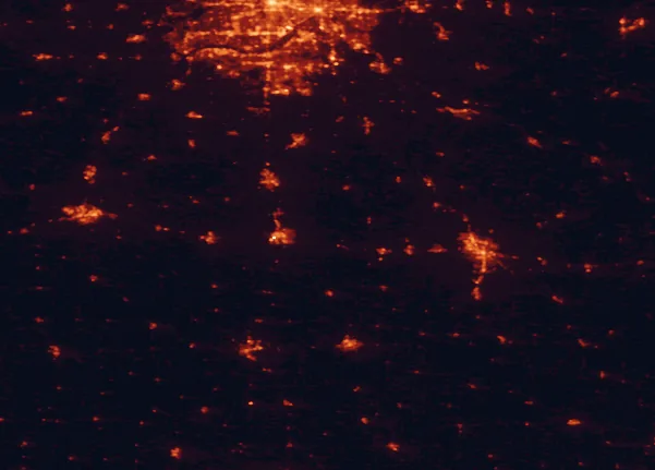 Satellite night-light map of the 100 km around Rice Lake State Park, with Rochester, Bloomington and Owatonna marked