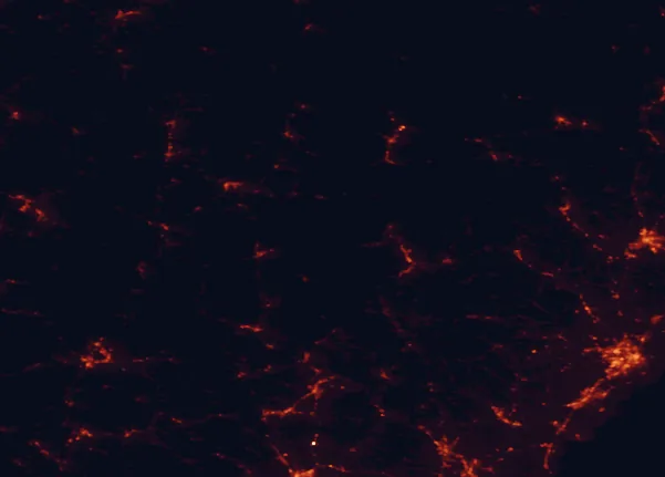 Satellite night-light map of the 100 km around White Mountain National Forest, with Portland, Lewiston and Rochester marked
