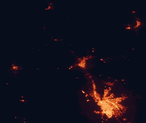 Satellite night-light map of the 100 km around Prehistoric Trackways National Monument, with Ciudad Juárez, El Paso and Las Cruces marked