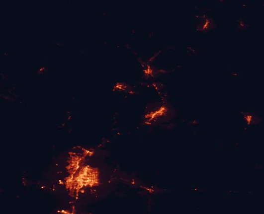 Satellite night-light map of the 100 km around Santa Fe National Forest, with Albuquerque, Santa Fe and Enchanted Hills marked