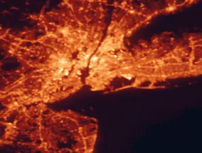 Satellite night-light map of the 50 km around Brooklyn, with New York City, Queens and Manhattan marked