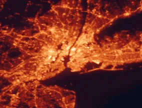 Satellite night-light map of the 50 km around New York City, with Brooklyn, Queens and Manhattan marked