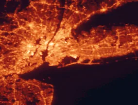 Satellite night-light map of the 50 km around Queens, with New York City, Brooklyn and Manhattan marked