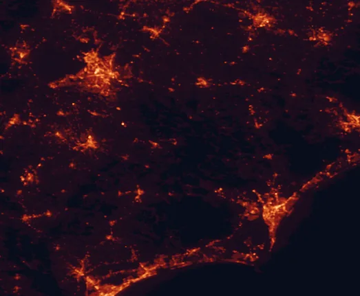 Satellite night-light map of the 100 km around Singletary Lake State Park, with Fayetteville, Wilmington and Jacksonville marked