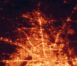 Satellite night-light map of the 50 km around The Woodlands, with Houston, Cypress and Spring marked