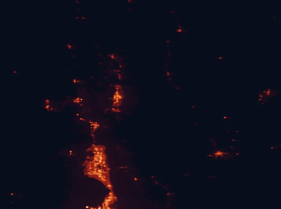 Satellite night-light map of the 100 km around Cache National Forest, with Logan, Ogden and Layton marked