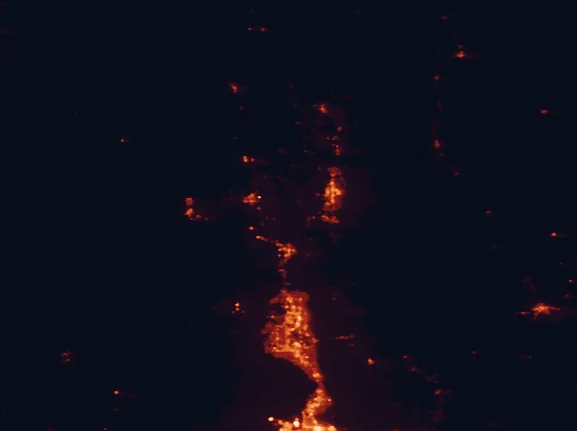 Satellite night-light map of the 100 km around Wasatch-Cache National Forest, with Logan, Ogden and Layton marked